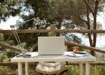 Digital Nomad Workplace - a laptop computer sitting on top of a white table.