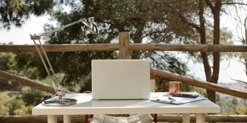 Digital Nomad Workplace - a laptop computer sitting on top of a white table.