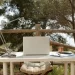 Digital Nomad Workplace - a laptop computer sitting on top of a white table.