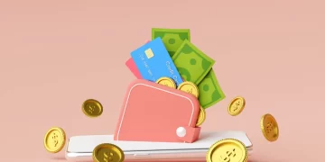 Digital banking concept with a wallet emerging from a smartphone screen shows various currency forms like cards, coins, and notes.