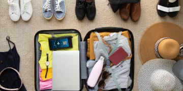 Packed suitcase for digital nomad travel