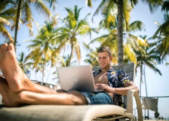 Digital nomad working at a beachside cafe