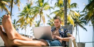 Digital nomad working at a beachside cafe